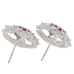 Oval pink sapphire sterling silver earrings with sparkling accents, perfect for elegant outfits.
