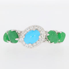 Blue turquoise sterling silver ring with green accents and sparkling gemstones on elegant band.