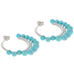 Blue turquoise sterling silver earrings with accent beads, perfect for elevating any elegant outfit.