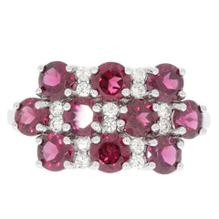 Stunning sterling silver ring featuring vibrant round red gemstones and sparkling accents for an elegant look.