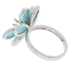 Elegant blue turquoise sterling silver ring with intricate butterfly design and sparkling accents.