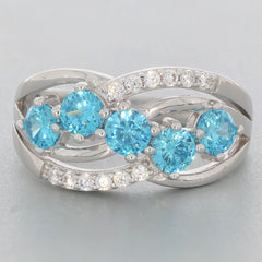 Blue Topaz Sterling Silver Ring featuring five sparkling blue gemstones and accent stones, elegantly intertwined design.