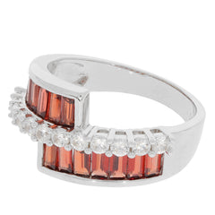Emerald Red Garnet sterling silver ring with Moissanite accents, showcasing elegant curved design and sparkling gemstones.