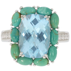Cushion blue topaz sterling silver ring with turquoise accents, showcasing elegance and luxury.