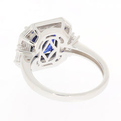 Blue sapphire sterling silver ring showcasing intricate design and gemstone from behind with a polished finish.