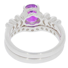 Round purple amethyst sterling silver ring with intricate design and sparkling gemstone accent.