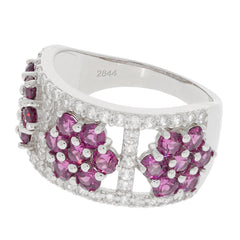 Elegant sterling silver ring featuring round purple sapphires and accents, showcasing luxury and sophistication.