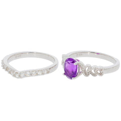 Round purple amethyst sterling silver ring with accent, featuring a brilliant gemstone and sparkling details.