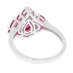 Pear Red Ruby Sterling Silver Ring showcasing red gemstones and elegant design from a side view.