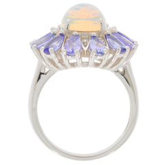 Blue Opal Sterling Silver Ring with accent gemstones, featuring elegant design and luxurious shine.