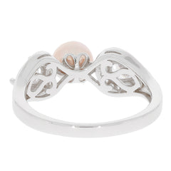 Elegant pink pearl sterling silver ring with intricate design, showcasing timeless beauty and sophistication.