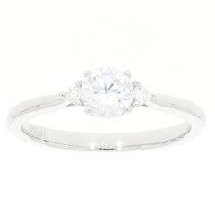 White Moissanite sterling silver ring with accent stones, featuring a brilliant round-cut gemstone in a sophisticated design.