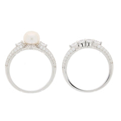 White pearl sterling silver ring with accent gemstones, showcasing elegance and luxury from multiple angles.