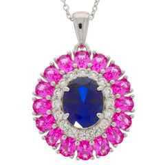 Oval blue sapphire pendant in sterling silver, surrounded by pink gemstones and sparkling accents, elegant jewelry piece.