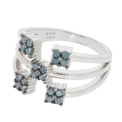 Blue diamond sterling silver ring with accent stones, showcasing elegant design and luxurious sparkle.