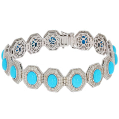 Oval Blue Turquoise Sterling Silver Bracelet with sparkling gemstone accents, elegant design, perfect for any sophisticated collection.
