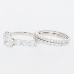 Round white Moissanite sterling silver ring set with sparkling accents, perfect for elegant jewelry collections.