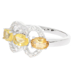 Oval yellow sapphire and diamond accent sterling silver ring showcasing luxury and elegance.