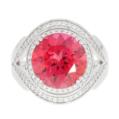 Round pink sapphire ring in sterling silver with sparkling accents, perfect for sophisticated elegance.