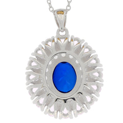 Oval blue sapphire sterling silver pendant with intricate design and shining accents, perfect for elegant occasions.