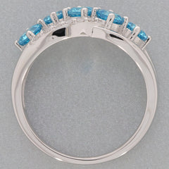 Blue topaz sterling silver ring with sparkling accents, showcasing an elegant design and brilliant gemstone details.