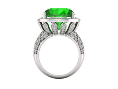 Elegant green emerald sterling silver ring with intricate designs and sparkling accents, showcasing luxury and sophistication.