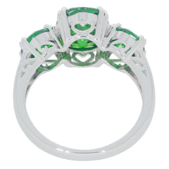 Green garnet sterling silver ring showcasing intricate design and sparkling gemstones for elegance.