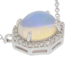 Elegant white opal cabochon set in sterling silver with sparkling accents, a luxurious accessory for any jewelry collection.