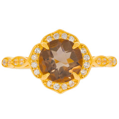 Round brown spinel ring in gold setting with moissanite accents, showcasing an elegant design.