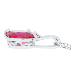 Side view of an oval red ruby sterling silver pendant with a decorative chain, showcasing its elegant design.