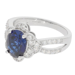 Blue Sapphire Sterling Silver Ring with accent gemstones, featuring an elegant design and sparkling details.