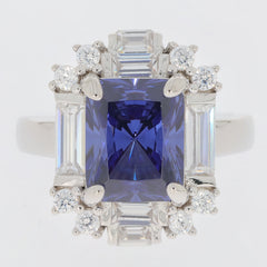 Blue sapphire sterling silver ring with accent diamonds, featuring an exquisite rectangular cut gemstone.