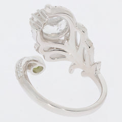 Sterling silver ring featuring a floral design and a sparkling gemstone accent, elegantly crafted for sophistication.