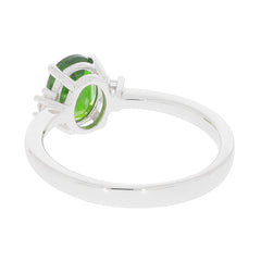 Oval green chrome diopside sterling silver ring, showcasing its elegant design from the side with a sparkling moissanite accent.