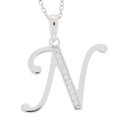 Elegant sterling silver initial 'N' pendant with sparkling gemstones on a delicate chain.