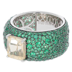 Yellow Moissanite Sterling Silver Ring with Emerald Accent, featuring intricate green gemstones and elegant design.