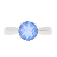 Round blue tanzanite sterling silver ring with elegant design, showcasing a sparkling gemstone centerpiece.