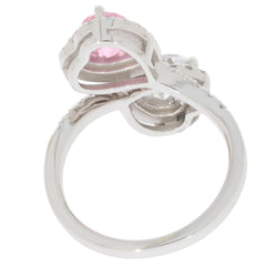 Heart pink sapphire sterling silver ring with moissanite accent viewed from the side, showcasing elegant design.