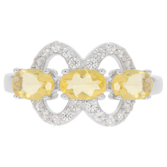 Oval yellow sapphire sterling silver ring with accent diamonds, elegant and luxurious design for a sophisticated style.