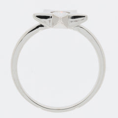 Round white moissanite sterling silver ring with a unique accent design, showcasing its elegant profile.