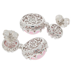 Elegant round pink pearl earrings in sterling silver with intricate design and sparkling accents.