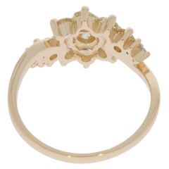Round green peridot ring with 14K yellow gold setting and sparkling accents, showcasing elegant craftsmanship.
