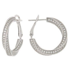 Elegant round white diamond sterling silver earrings with accent stones for a luxurious style.