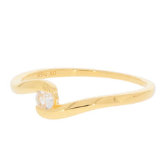 Elegant gold ring with sparkling diamond, showcasing a unique wave design in sterling silver, perfect for any sophisticated outfit.