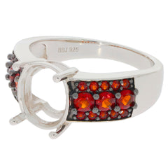 Oval red garnet sterling silver ring with sparkling accents, showcasing elegance and luxury in jewelry design.