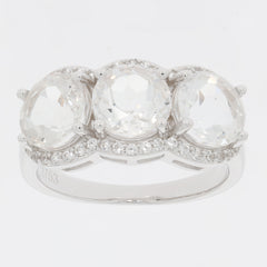 Round white Moissanite sterling silver ring with three sparkling stones and accent diamonds.