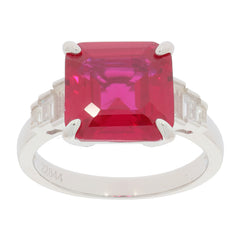 Emerald red ruby sterling silver ring with moissanite accents, featuring a sparkling red gemstone centerpiece.