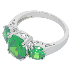 Elegant green garnet sterling silver ring featuring three sparkling gemstones, showcasing luxury and sophistication.