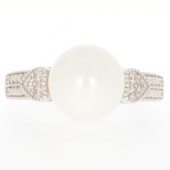 White Pearl Sterling Silver Ring with Moissanite accents, showcasing elegance and luxury in jewelry.
