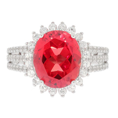 Oval red spinel sterling silver ring with accent stones, showcasing elegance and luxury in design.